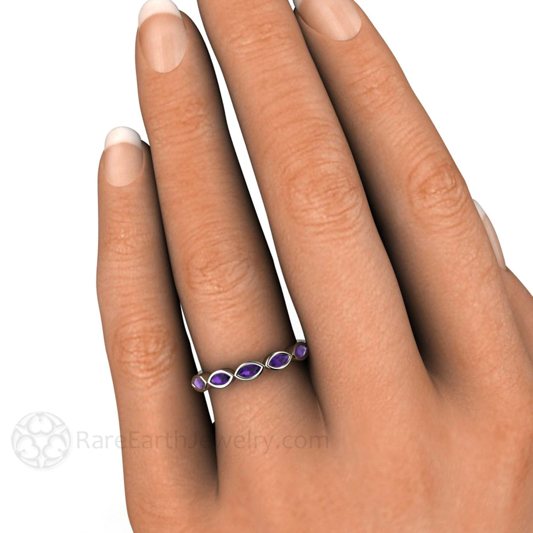 Amethyst stacking ring with marquise cut gemstones set east to west, modern design in 14K or 18K Gold, shown on hand.