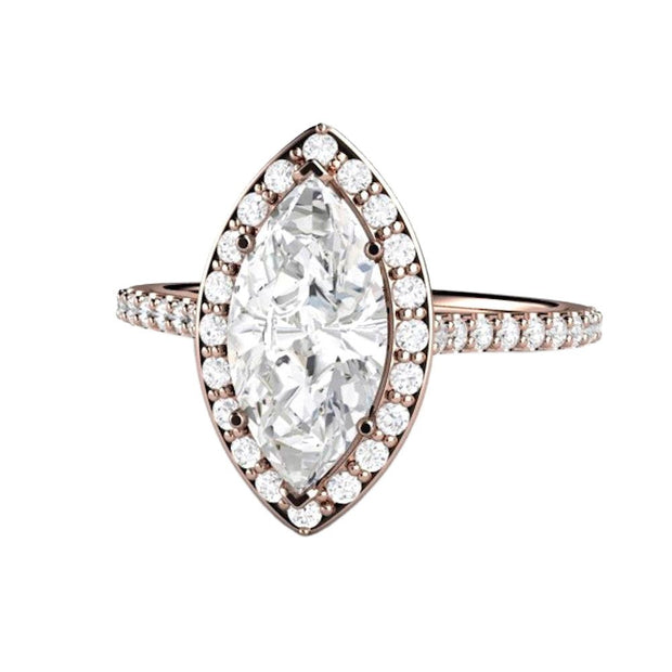 A marquise cut Moissanite engagement ring with pave set diamond halo, dainty feminine style with Forever One Moissanite, a lab created diamond alternative from Rare Earth Jewelry.