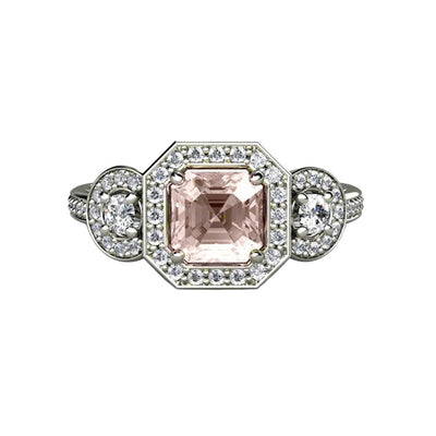 A 3 stone Morganite engagement ring with an asscher cut natural Morganite and diamond accents in a halo. 