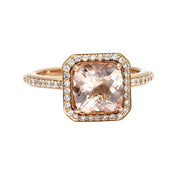 A square cushion cut Morganite engagement ring with diamond halo and diamond accented band in gold or platinum from Rare Earth Jewelry.