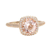 A 2 Carat Morganite Engagement Ring with a pave diamond halo cathedral setting in rose gold from Rare Earth Jewelry.