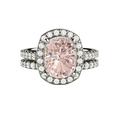 A large cushion cut natural Morganite engagement ring with a pave diamond halo, and the matching diamond wedding band. A peachy pink Morganite bridal set in gold or platinum from Rare Earth Jewelry..