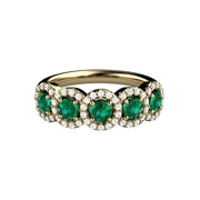 Halo-style ring with five round natural emeralds encircled by diamonds. Unique May birthstone wedding band or engagement, shown in yellow gold from Rare Earth Jewelry.