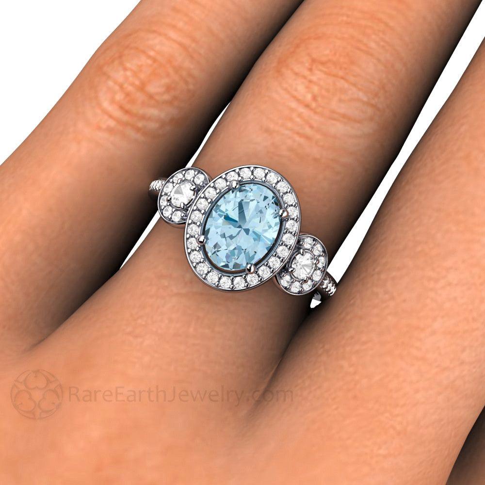 Oval Aquamarine Engagement Ring | Three-Stone Diamond Halo Setting, 8x6 Oval Aquamarine Ring on the Hand, Size 7 Finger