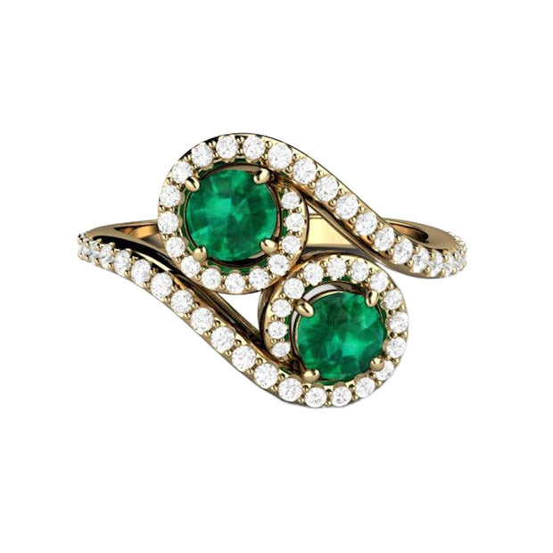 An Antique Style Emerald Ring in a two stone Toi et Moi design.  A unique emerald and diamond engagement ring.