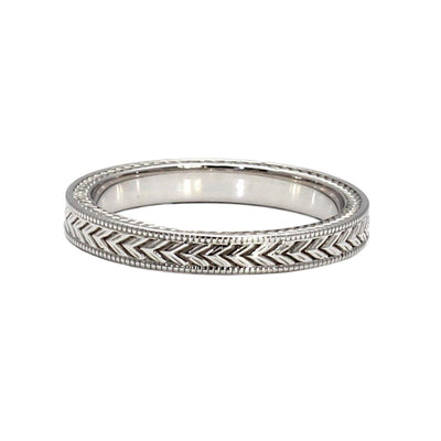 A vintage style wedding band with a chevron pattern and milgrain beaded edge detailing.  This antique style wedding ring is 3mm wide and available in gold or platinum.