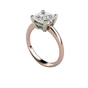 A traditional classic solitaire engagement ring with an asscher cut White Sapphire in a two-tone gold setting with double prongs. Unique diamond alternative engagement rings from Rare Earth Jewelry.