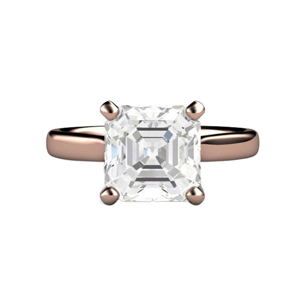 A White Sapphire engagement ring in a four prong solitaire setting in rose gold with a large asscher cut white sapphire, an affordable diamond alternative.