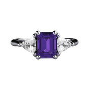 A natural Amethyst ring with an emerald cut Amethyst and White Sapphire Trillions 3 Stone Style in Gold or Platinum from Rare Earth Jewelry