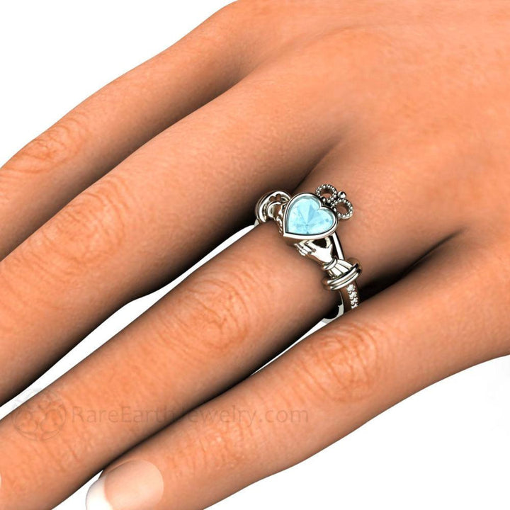 Aquamarine Claddagh Ring, Natural Gemstone Claddagh Ring Traditional Irish Engagement Ring or Promise Ring, shown on the hand.