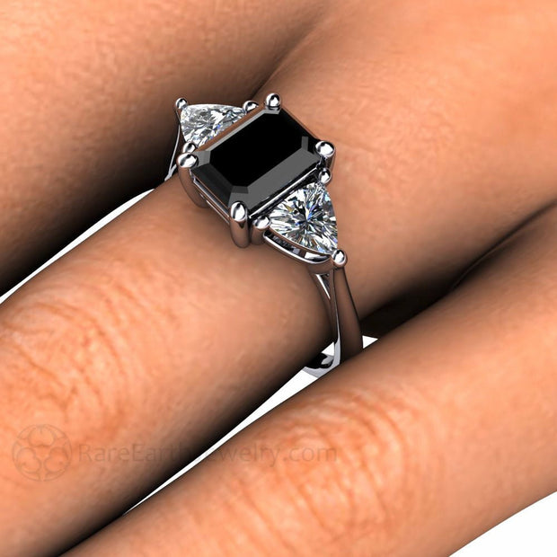 Emerald cut Black Diamond Engagement ring with Diamond Trillions on the Hand from Rare Earth Jewelry