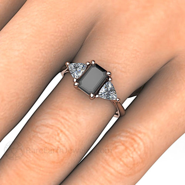 Emerald cut Black Diamond Engagement Ring on the Hand from Rare Earth Jewelry