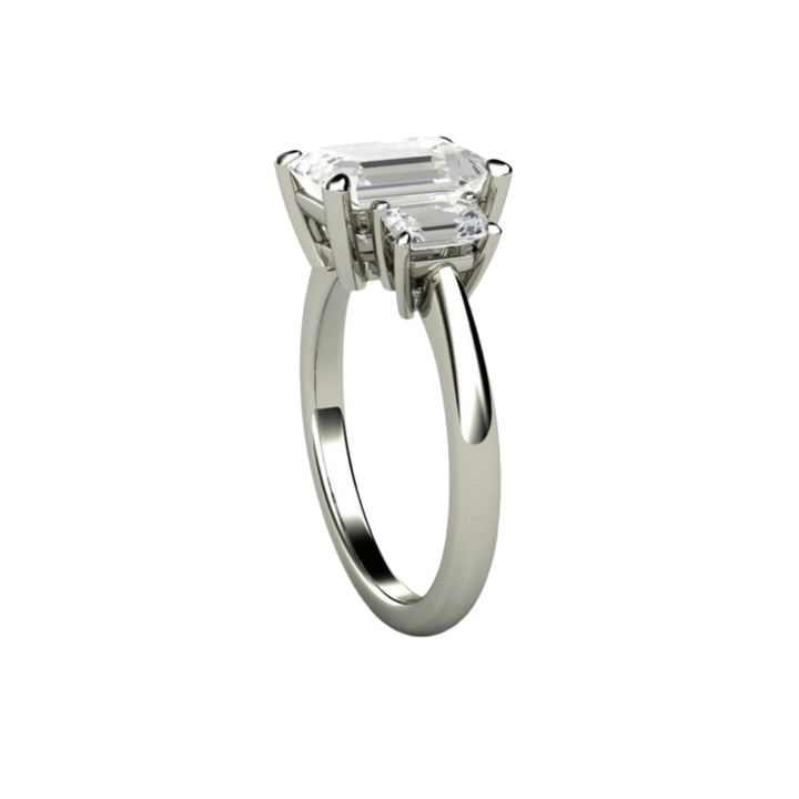 Side View of Three Stone Emerald Cut Moissanite Engagement Ring showing Classic Basket Design with Tapered Band | Rare Earth Jewelry