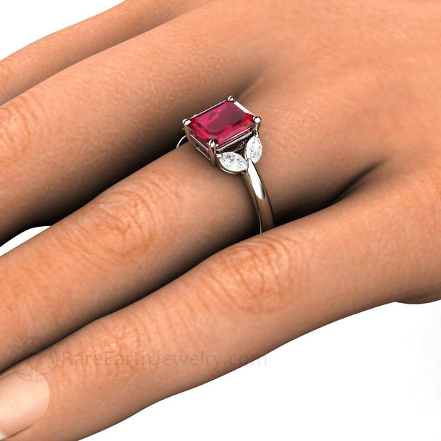 2 Carat Ruby Ring on the Hand.  Ruby and Diamond Engagement Ring on the Finger Hand Shot by Rare Earth Jewelry