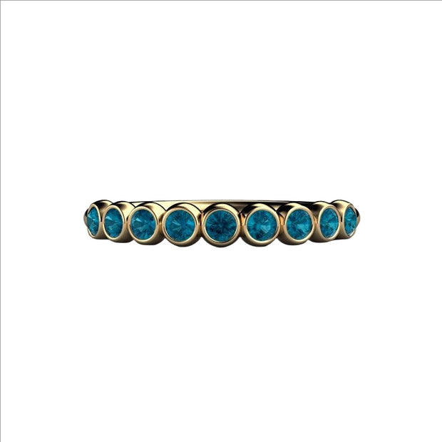 A teal blue natural diamond bubble band, unique bezel set diamond wedding ring, shown in yellow gold from Rare Earth Jewelry.