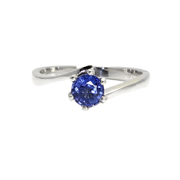 Close-up of 6-prong solitaire sapphire engagement ring in white gold with bypass shank | Rare Earth Jewelry