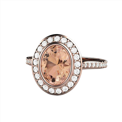 Morganite Oval Engagement Ring with a Bezel Set Diamond Halo Design and a Natural Peach Morganite center stone, shown in Rose Gold from Rare Earth Jewelry.