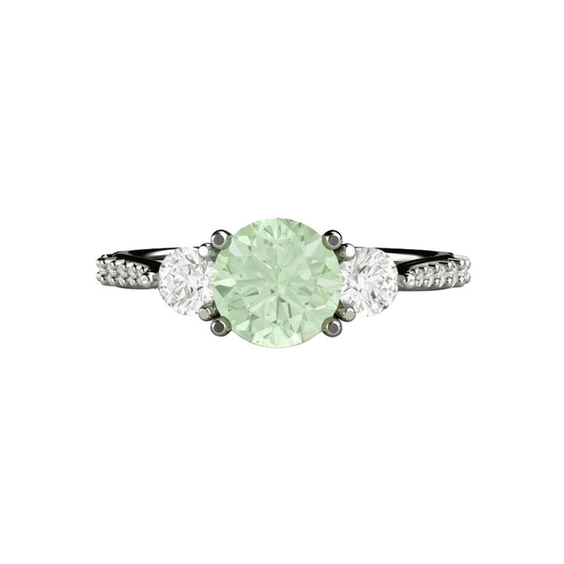 A Light Pastel Green Moissanite Engagement Ring with a 3 Stone Style and Forever One Moissanite Side Stones and Pave set Diamond Accents in gold or platinum from Rare Earth Jewelry.