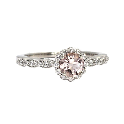 A peach pink natural Morganite engagement ring with a vintage style design and diamond halo and accents in gold or platinum from Rare Earth Jewelry.