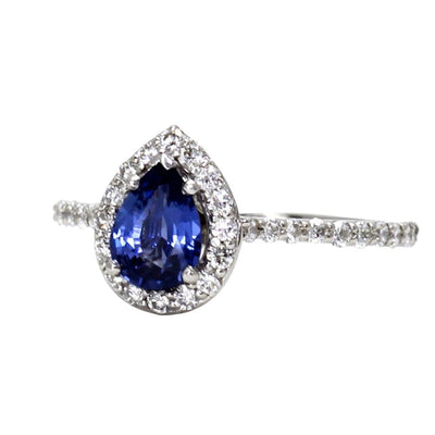 Natural Blue Sapphire Pear Engagement Ring with Pave Set Diamond Accents with a Diamond Halo Design in Gold or Platinum from Rare Earth Jewelry.