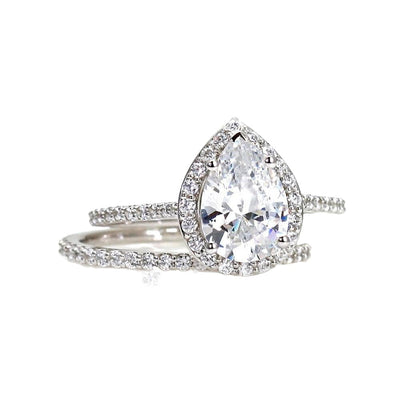 Pear Cut Charles & Colvard Forever One Moissanite Engagement Ring with Diamond Halo, Wedding Set includes the matching band from Rare Earth Jewelry