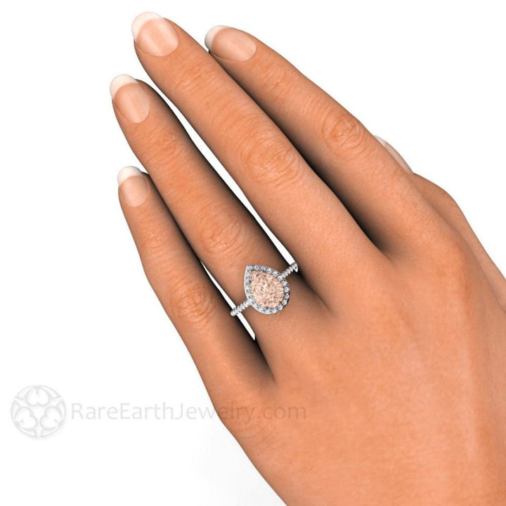 Pear Cut Morganite Engagement Ring on the Hand, Pave Diamond Halo | Rare Earth Jewelry