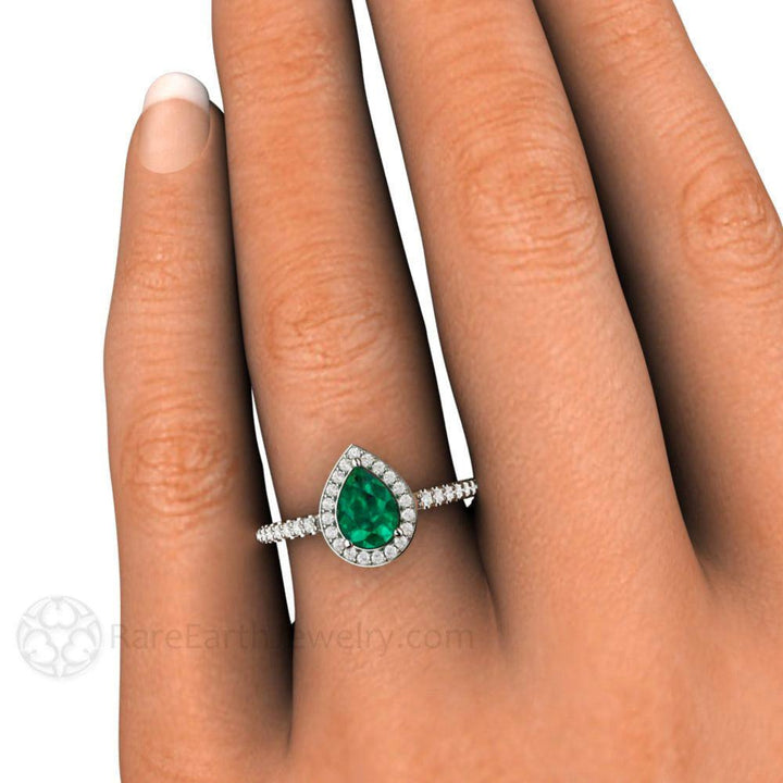 Pear Cut Natural Emerald Engagement Ring with Diamond Halo, Shown on the Hand | Rare Earth Jewelry