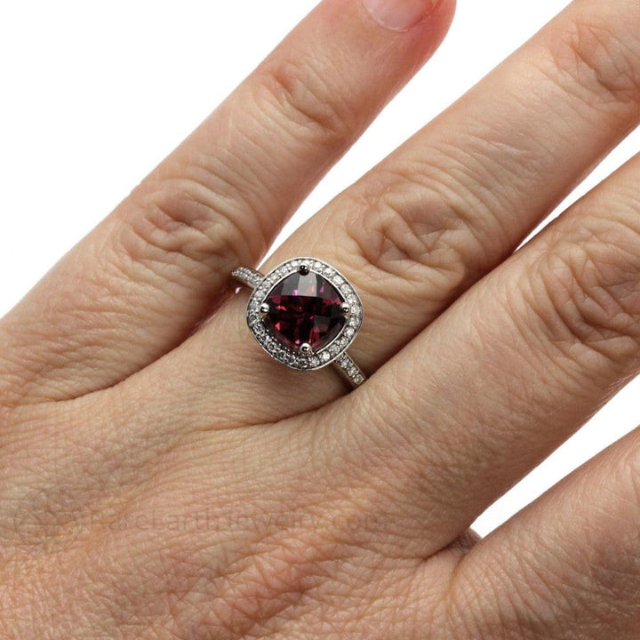 Rhodolite Garnet Engagement Ring shown on the Hand, Cushion Cut Garnet Ring with Diamond Halo | Rare Earth Jewelry