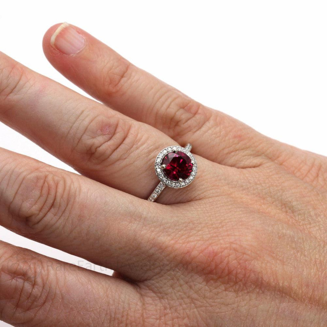7mm Round Ruby Engagement Ring with Diamond Halo shown on the Finger, Lab Grown Ruby Ring Hand Shot, July Birthstone Ring | Rare Earth Jewelry