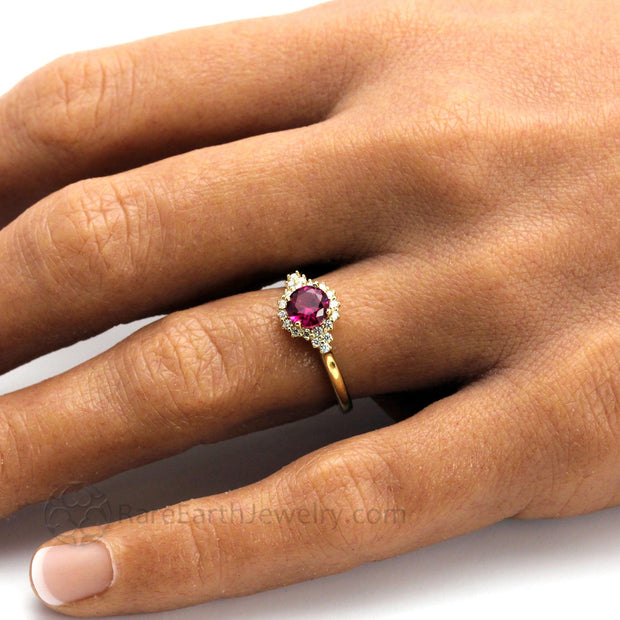Ruby Engagement Ring Diamond Cluster Halo Design in Yellow Gold Hand Shot by Rare Earth Jewelry- Rare Earth Jewelry