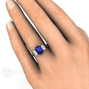 Three Stone Blue Sapphire Engagement Ring Emerald Cut with White Sapphire Accents on the Hand - Rare Earth Jewelry
