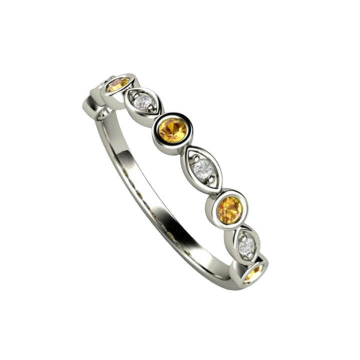 A yellow sapphire and diamond ring with a modern bezel set design.  Natural gemstone Band in Gold or Platinum.  Yellow gemstone stacking ring from Rare Earth Jewelry